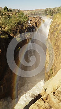 Epupa Falls Waterfall with Baobab trees at the border of Namibia and Angola in Kaokoland, Southern Africa. photo