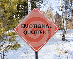 EQ emotional quotient symbol. Concept words EQ emotional quotient on beautiful red road sign. Beautiful forest snow blue sky