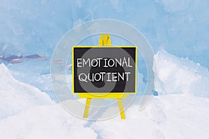 EQ emotional quotient symbol. Concept words EQ emotional quotient on beautiful yellow black blackboard. Beautiful blue ice