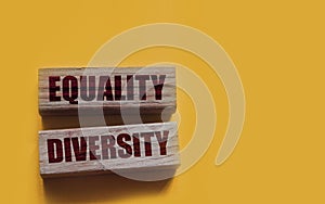 Equality diversity words written on wood blocks. ETolerance inclusion social and business concept photo