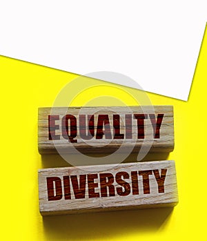 Equality diversity words written on wood blocks. ETolerance inclusion social and business concept photo