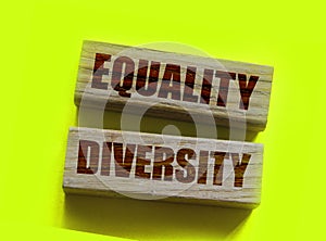 Equality diversity words written on wood blocks. Tolerance inclusion social and business concept photo