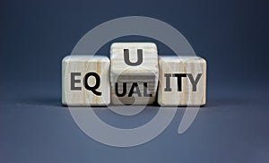 Equality or equity symbol. Turned a cube and changed the word `equality` to `equity`. Beautiful grey background. Psychology, photo