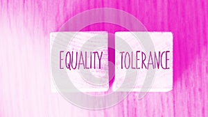 Equality tolerance words written on wood blocks. Equal rights inclusion social and business concept photo