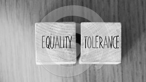 Equality tolerance words written on wood blocks. Equal rights inclusion social and business concept photo