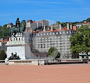 Equestrain statue of french King Louis XIV in the Main square in