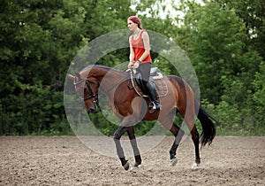 Equestrian girl horseback riding trot