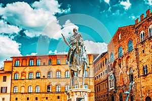 Equestrian statue on Cosimo  Statua equestre di Cosimo I on Square of Signoria Piazza della Signoria with tourists. Italy