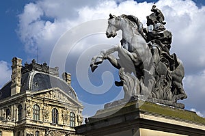 Equestrian statue of king Louis XIV in courtyard of the Louvre museum photo