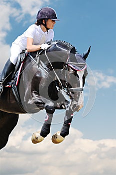 Equestrianism: Young girl in jumping show