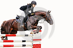 Equestrianism: Young girl in jumping show, isolated