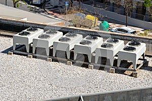 Equipment of air conditioner units on a roof of an industrial building