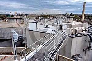 Equipment, cables and piping as found inside of industrial plant