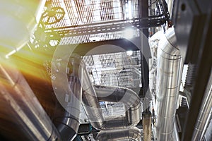 Equipment, cables and piping as found inside of a modern industrial power plant