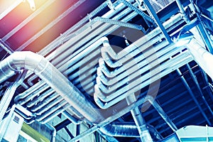 Equipment, cables and piping as found inside of a modern industrial power plant