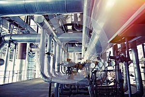 Equipment, cables and piping as found inside of a modern industrial power plant