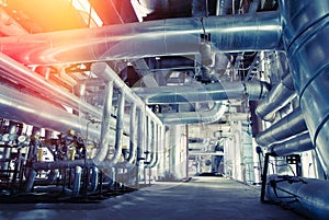 Equipment, cables and piping as found inside of a modern industrial power plant