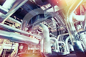 Equipment, cables and piping as found inside of a modern industrial power plant