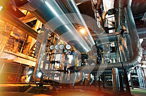 Equipment, cables and piping as found inside of a modern industrial power plant