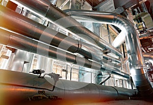 Equipment, cables and piping as found inside of a modern industrial power plant