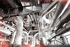 Equipment, cables and piping as found inside of a modern industrial power plant