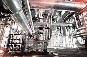 Equipment, cables and piping as found inside of a modern industrial power plant