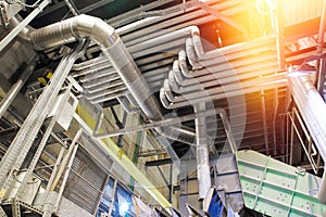 Equipment, cables and piping as found inside of a modern industrial power plant