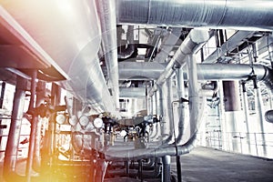 Equipment, cables and piping as found inside of a modern industrial power plant