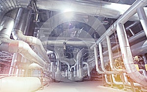 Equipment, cables and piping as found inside of a modern industrial power plant