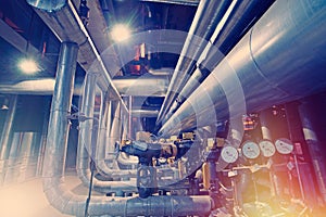 Equipment, cables and piping as found inside of a modern industrial power plant