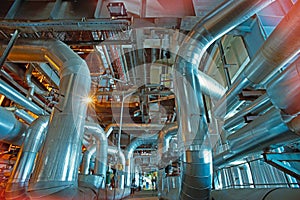 Equipment, cables and piping as found inside of a modern industrial power plant