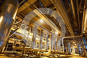 Equipment, cables and piping as found inside of a modern industrial power plant