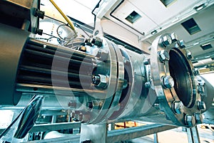 Equipment, cables and piping as found inside of a modern industrial power plant