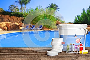 Equipment with chemical cleaning products and tools for the maintenance of the swimming pool.