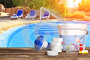 Equipment with chemical cleaning products and tools for the maintenance of the swimming pool.