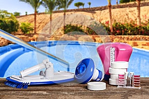 Equipment with chemical cleaning products and tools for the maintenance of the swimming pool.