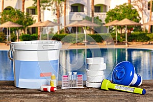 Equipment with chemical cleaning products and tools for the maintenance of the swimming pool.