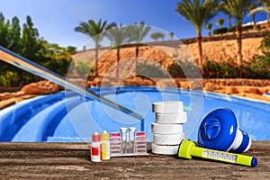 Equipment with chemical cleaning products and tools for the maintenance of the swimming pool.