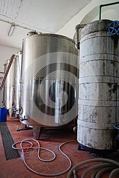 Equipment of contemporary winemaker factory with stell barrels