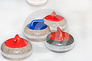 Curling stones on the ice