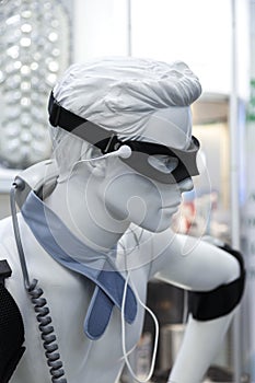 Equipment for diagnostics and treatment, wires and electrodes on white mannequin man. Medical microcomputer equipment