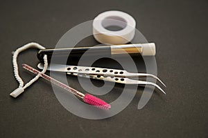 Equipment for eyelash extensions on a dark background