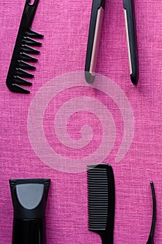 Equipment for hairdresser on pink background and space for text