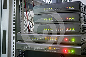 Equipment for Internet connection works in computer racks. Several digital communication gateways are in the server room. photo