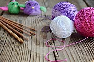 The equipment for knitting and crochet hook, colorful rainbow cotton yarn, ball of threads, wool. Handmade crocheting crafts. DIY