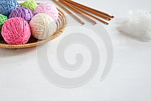 The equipment for knitting and crochet hook, colorful rainbow cotton yarn, ball of threads, wool. Handmade crocheting crafts. DIY