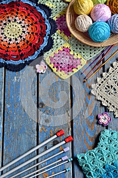 Equipment for knitting and crochet hook, colorful rainbow cotton yarn, ball of threads, wool, knitted elements, napkin . Granny