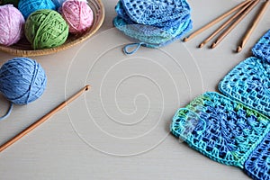 Equipment for knitting and crochet hook, colorful rainbow cotton yarn, ball of threads, wool, knitted elements, napkin . Granny