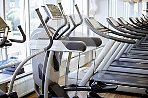 Equipment And Machines At The Modern Gym Room Fitness Center.