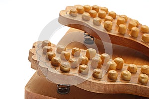The equipment for massage of foot by wood material
